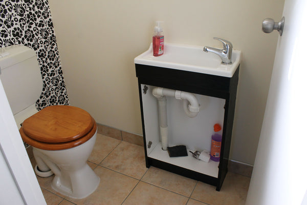 small guest toilet with vanity without doors at the front