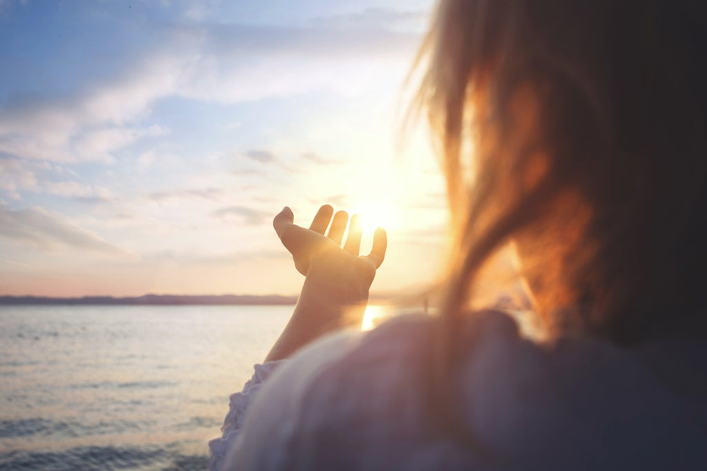 Woman looking towards the sun