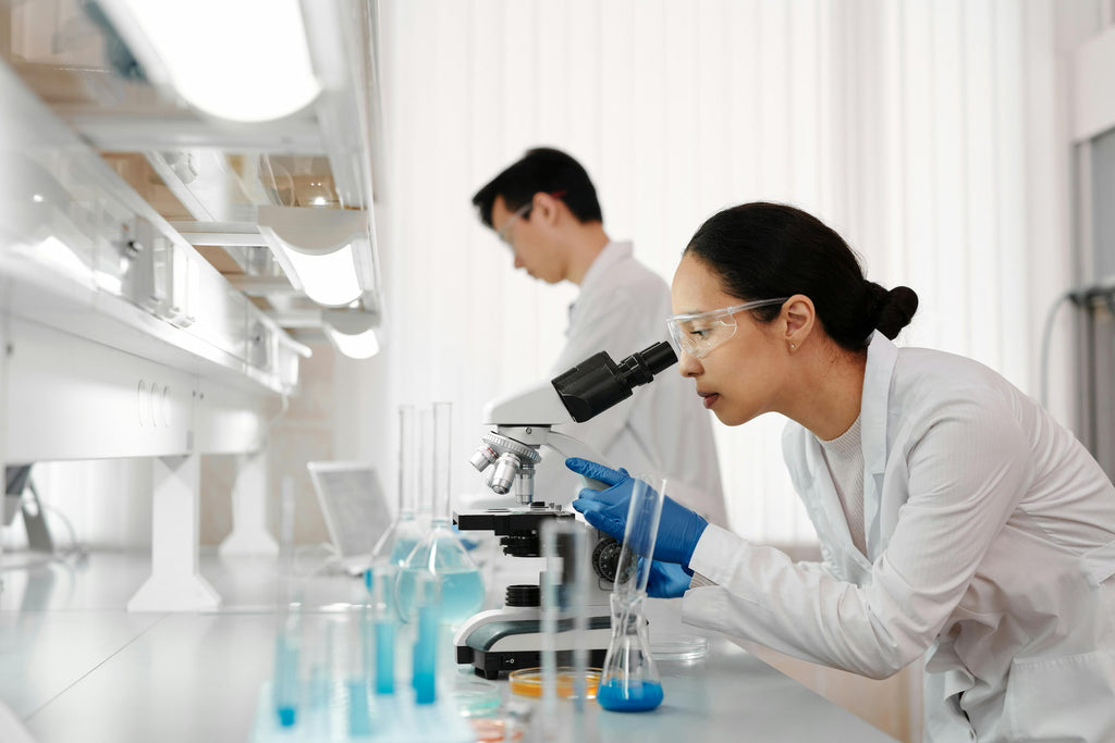 Scientist looking through a microscope