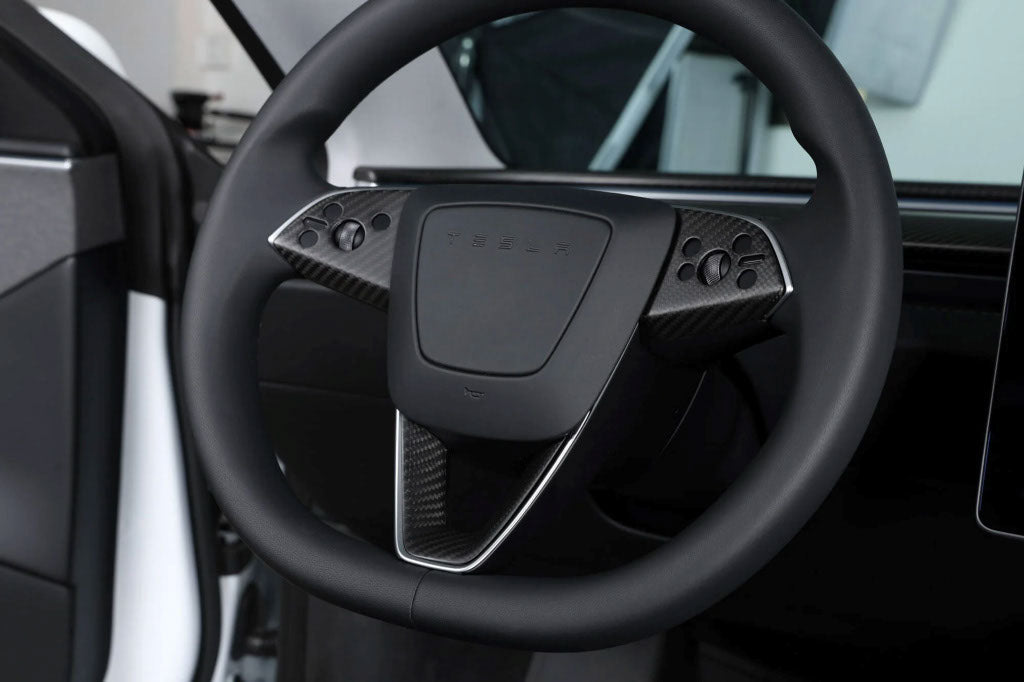 Carbon steering wheel in a Tesla Highland