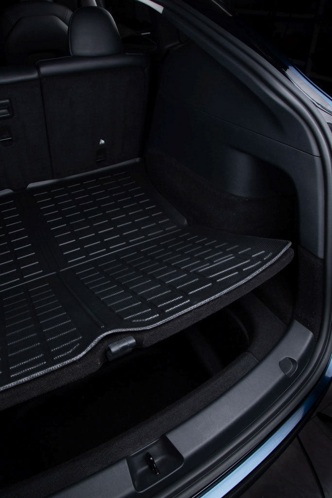 Floor mat liners inside a Tesla vehicle