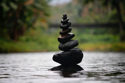 Rocks stacked as fascinating display of extraordinary balance in meditation