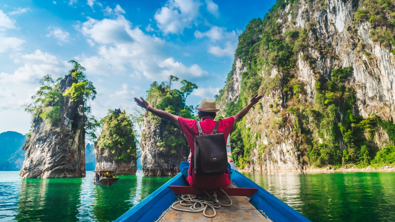 man-on-boat-travel-worry-free-thanks-to-travel-insurance
