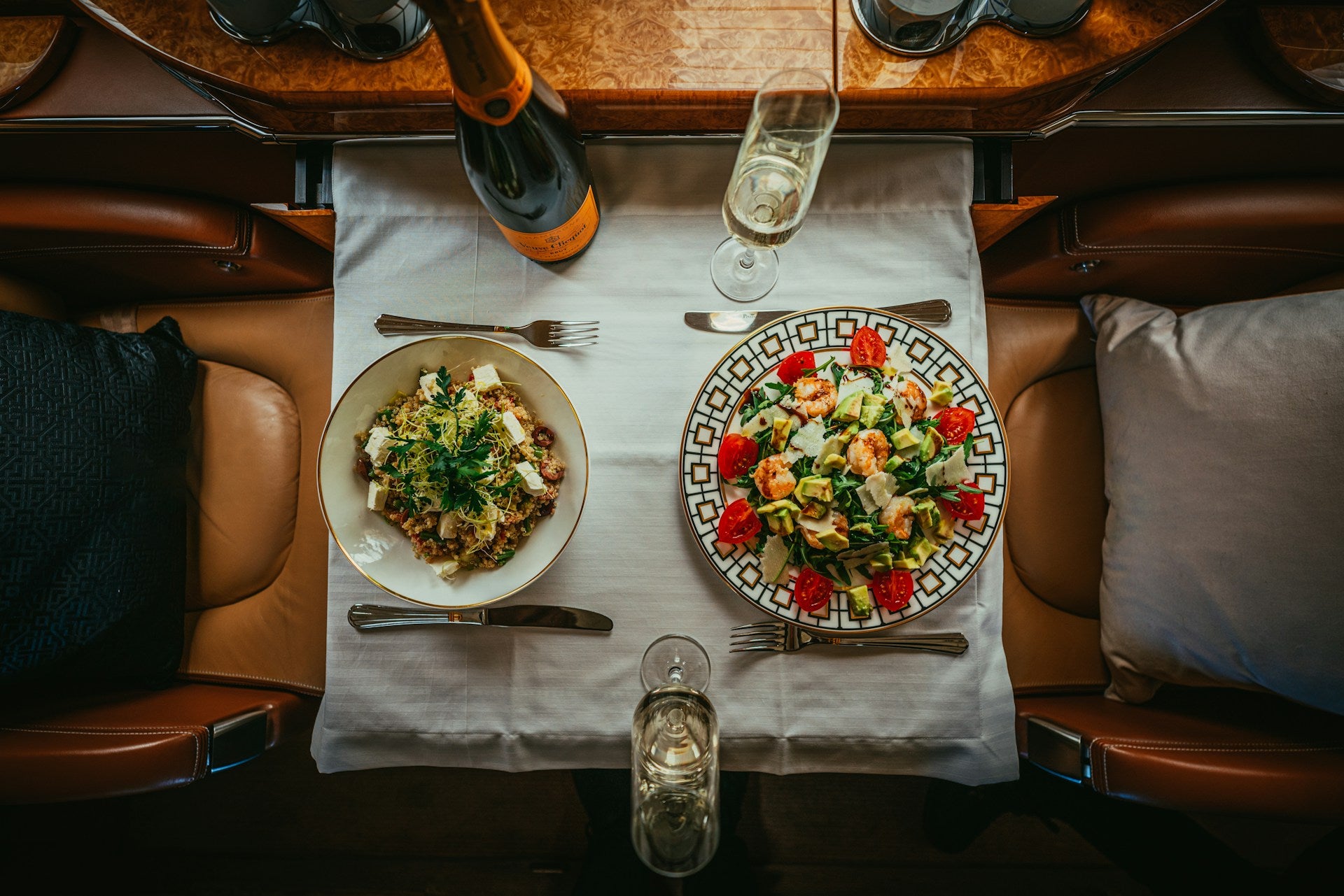 https://unsplash.com/photos/a-table-with-plates-of-food-and-glasses-on-it-W1hRt9KiFXY