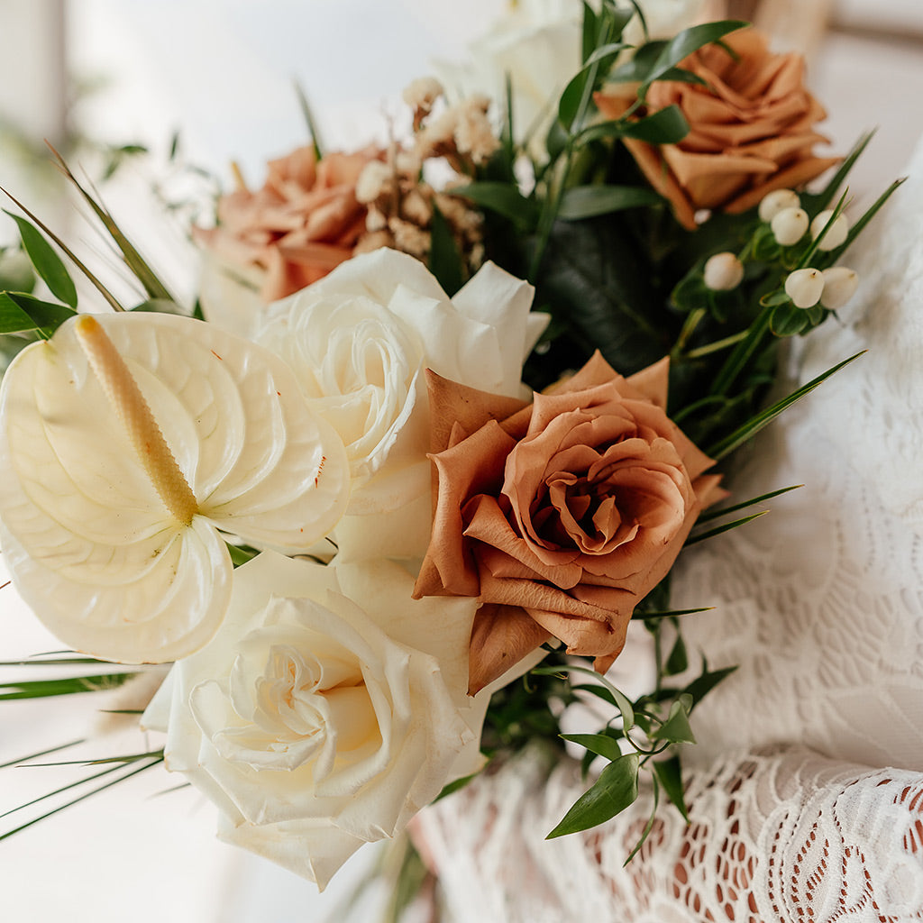 Burnt orange and white wedding flowers for safari wedding