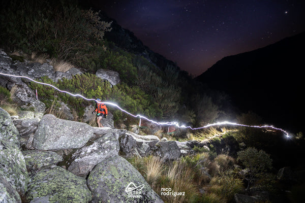 Man running on a trail at night at Ultra Sanabria.