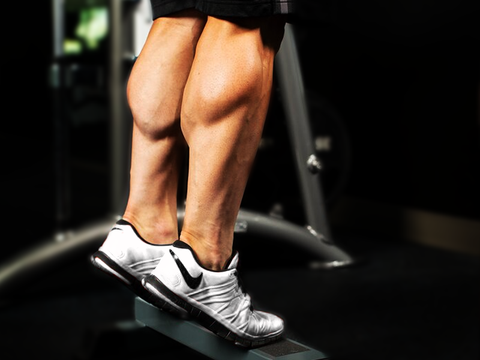 Photo of flexed calf muscles.