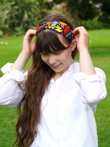 Model wearing colour silk headband