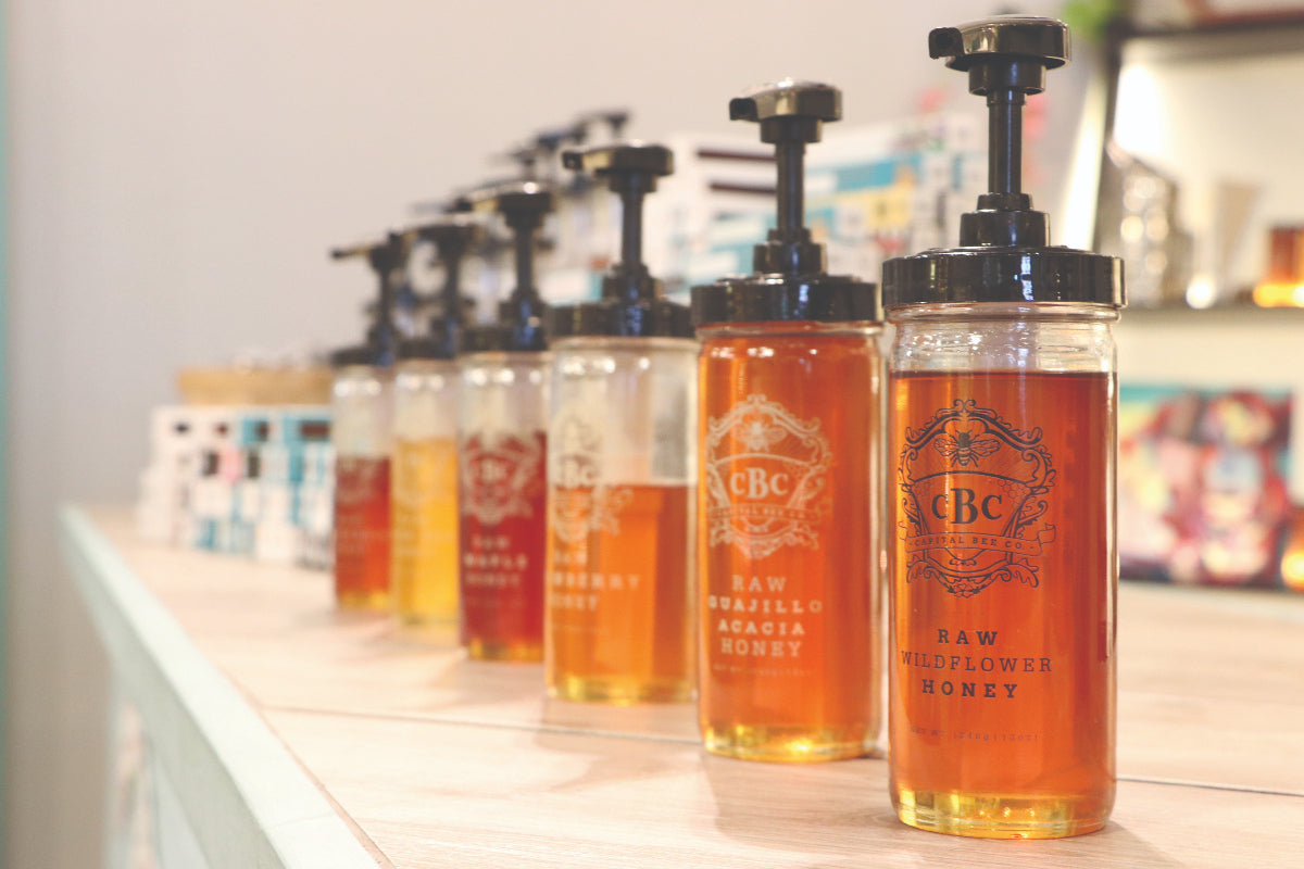 Honey jars lined up on countertop