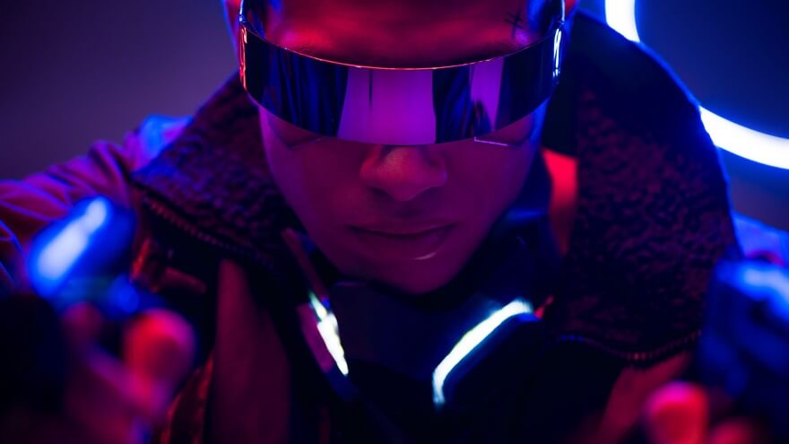 A punk guy with flashy futuristic mirror shades