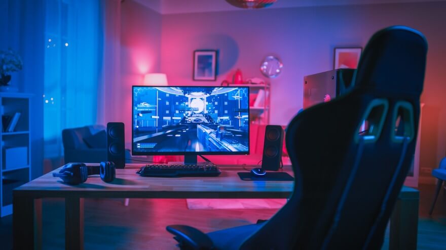 A minimalist gamer setup with a monitor and a gaming chair