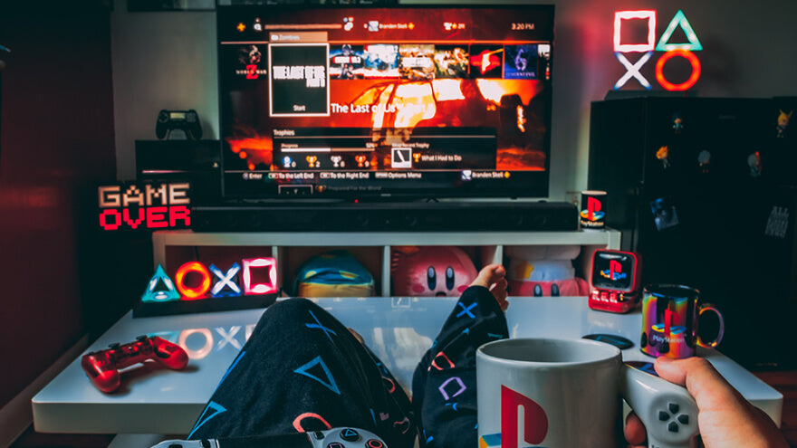 A gaming room with a Playstation theme decor