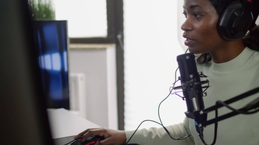 A colour caster girl commentating on high-level game matches