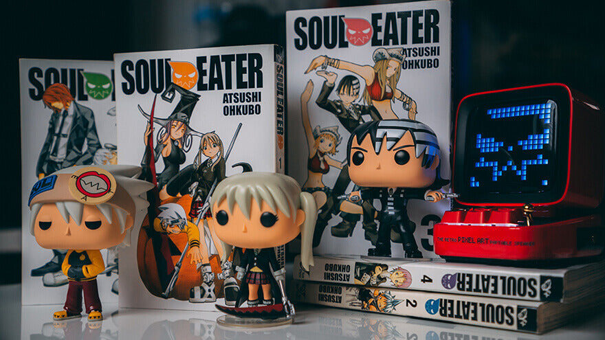 Some Soul Eater manga books alongside anime Funko POP! figures