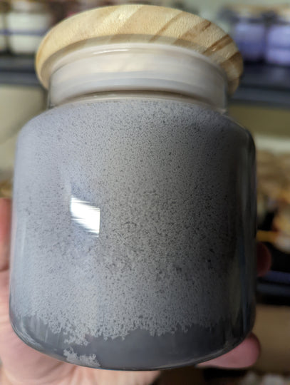 Soy wax frosting on a gray candle