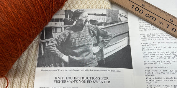 monochrome image of man wearing guernsey jumper