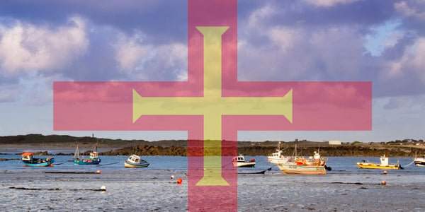 guernsey fishing village with flag