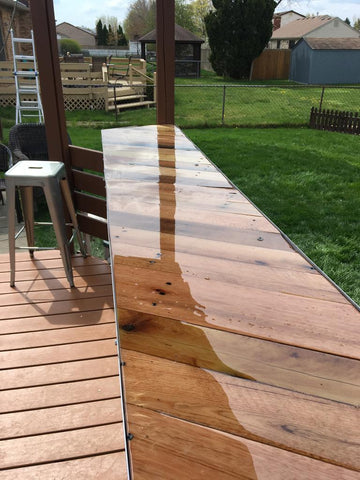 An outdoor epoxy bar top with a glasslike finish