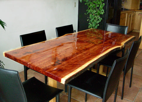 A wooden epoxy dining table