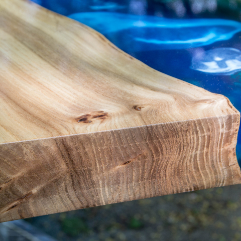 A close-up view of an epoxy river table top