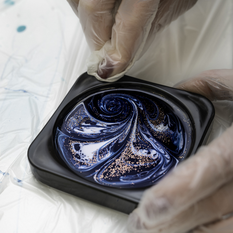 An epoxy coaster being created in a mold, with pigments