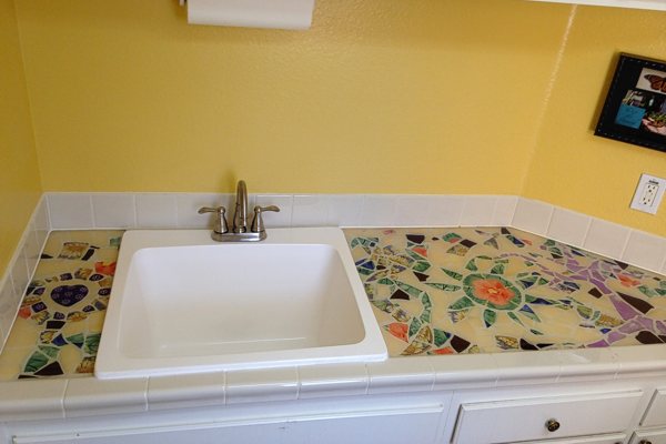 An epoxy countertop with a carved tile substrate.