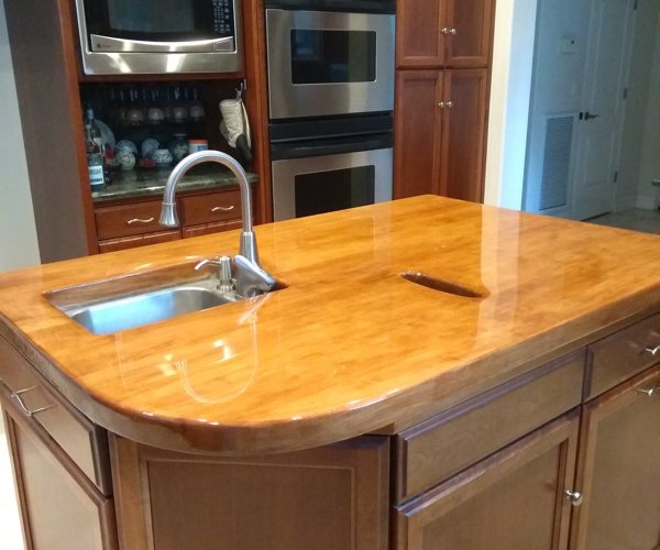An epoxy kitchen countertop with a light-toned wooden substrate