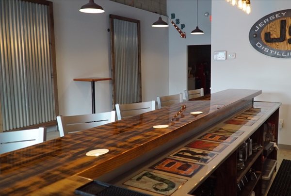 A wooden epoxy bar top with an extensive epoxy flood coating of UltraClear Bar & Table Top Epoxy