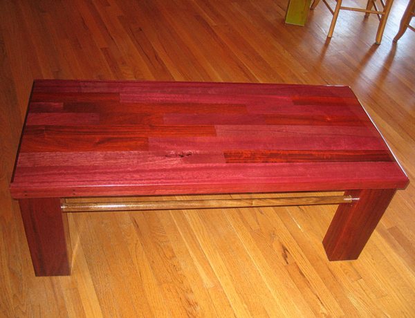 A red-painted wooden table top with a coating of UltraClear Bar & Table Top Epoxy