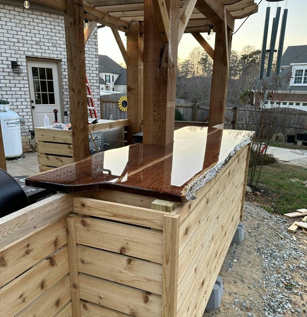An outdoor wooden epoxy bar top.