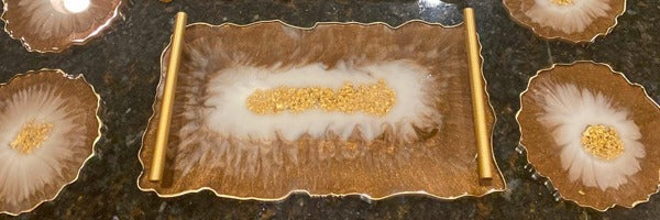 An epoxy resin tray with golden flakes embedded in the center