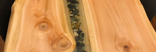 An epoxy table embedded with numerous small stones