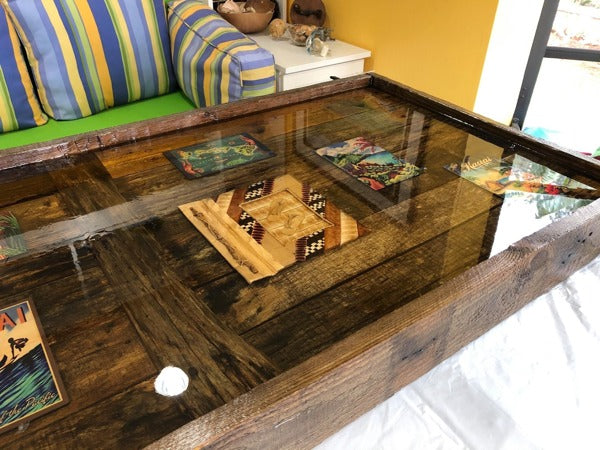 An epoxy coffee table with embedded mementos.