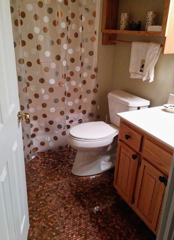 An epoxy penny bathroom floor