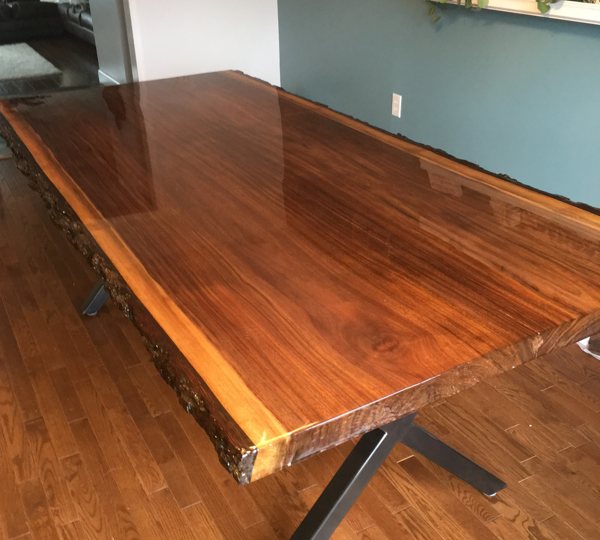 A live-edge wooden epoxy table top.