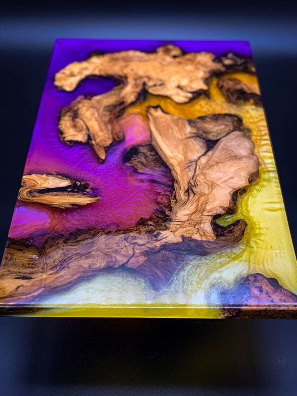 An epoxy river table top with several pigments used