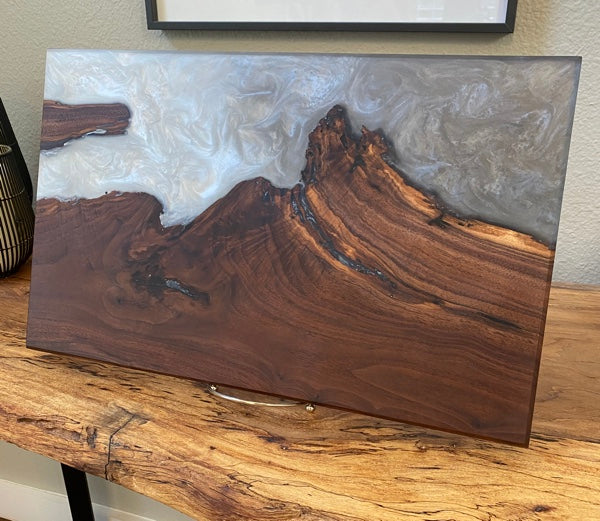 An epoxy serving tray made with wood and glacier hue