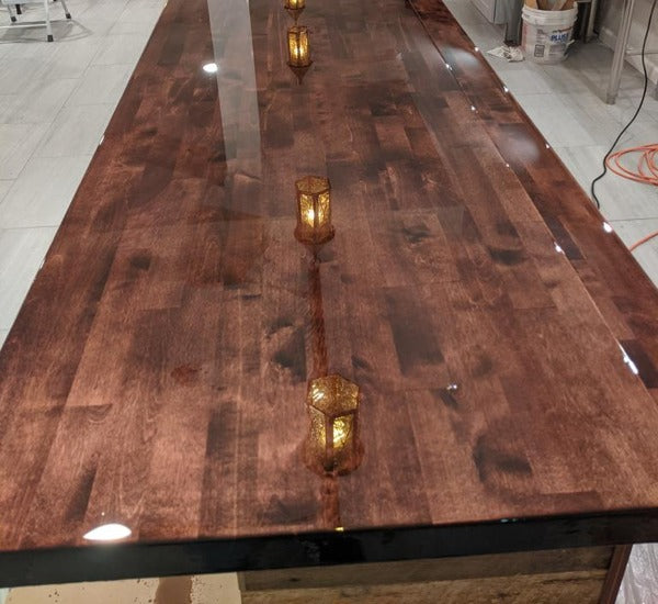 A long wooden bar top with an epoxy coating.
