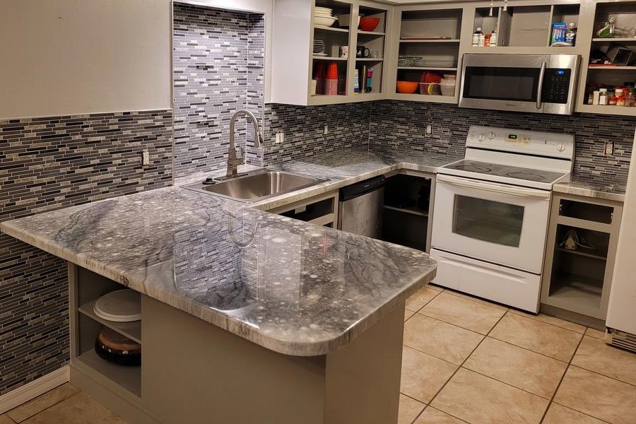 A kitchen with epoxy countertops.