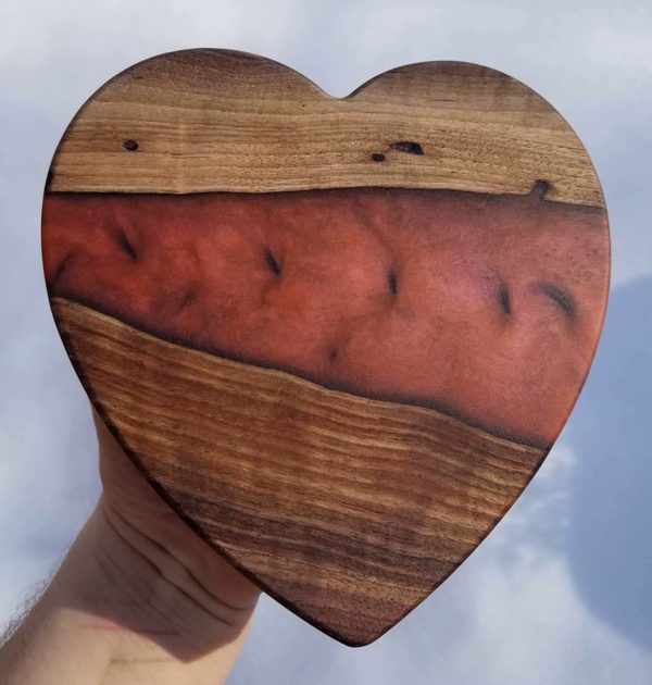 A heart-shaped wooden epoxy carving