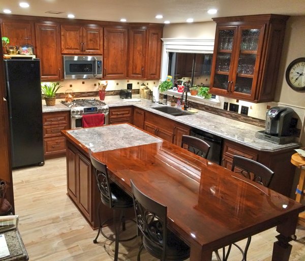 A renovated kitchen with a series of countertops coated in UltraClear Bar & Table Top Epoxy Resin.