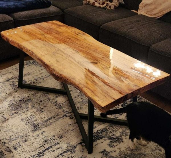 A live-edge wooden epoxy coffee table.