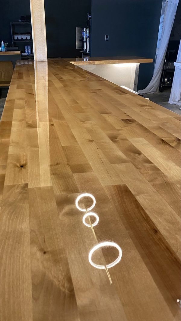 An epoxy bar top with light toned wood