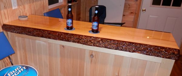 A wooden epoxy bar top with a live edge