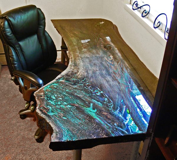 An epoxy live edge desk table