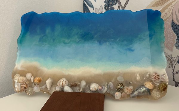 An ocean resin art tray made using UltraClear Epoxy and three Pigmently pigments—Porcelain White, Real Royal Blue, and River Table Turquoise.