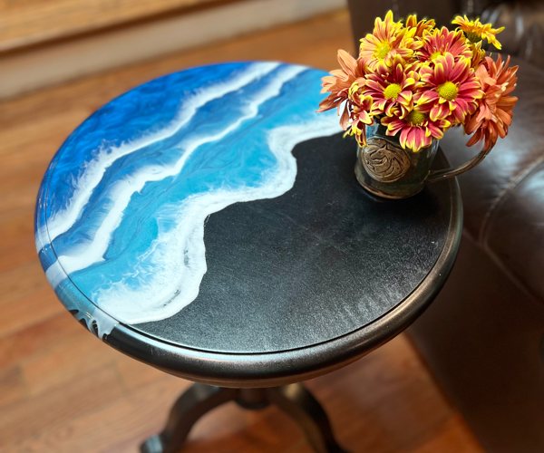 An epoxy coffee table top with an ocean-themed resin finish.