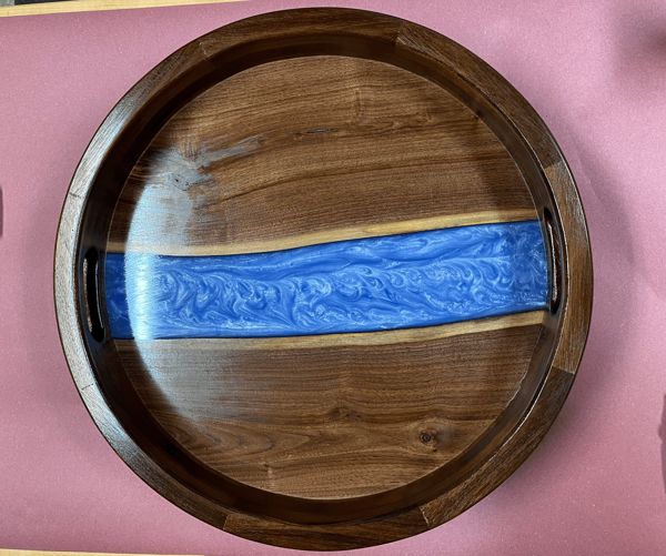 A river vein epoxy resin tray made with walnut wood.