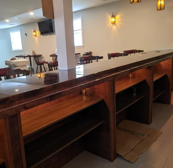 A wooden bar top with an epoxy finish.