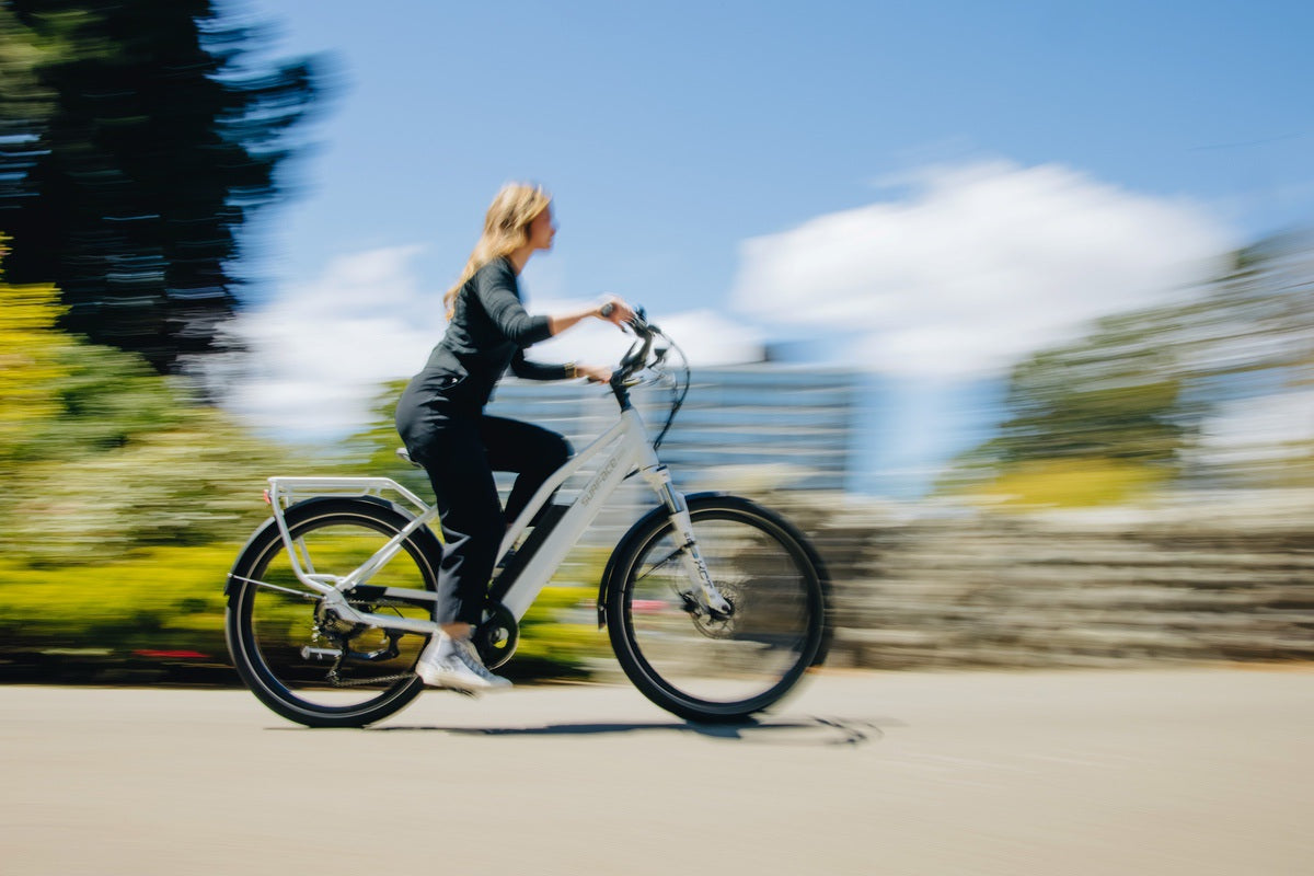 Women Riding eBike at speed with pedal assist